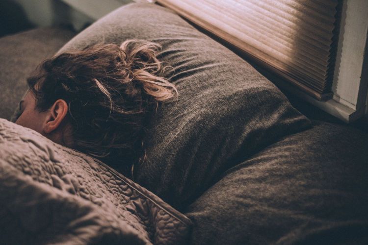 woman laying down in bed