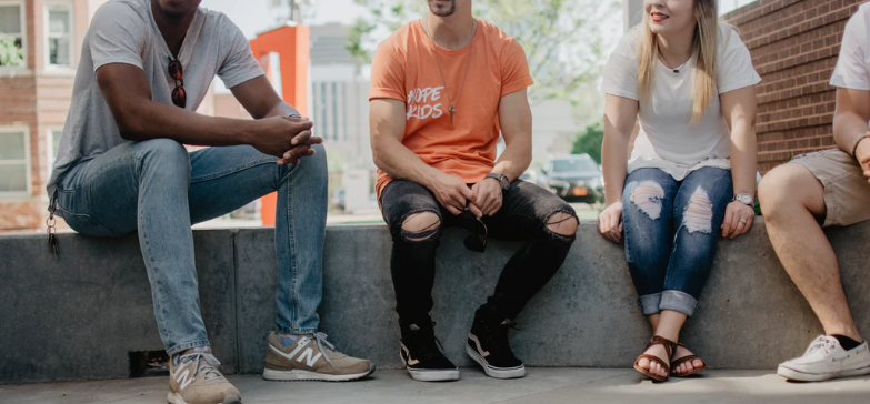 group of people sitting outside