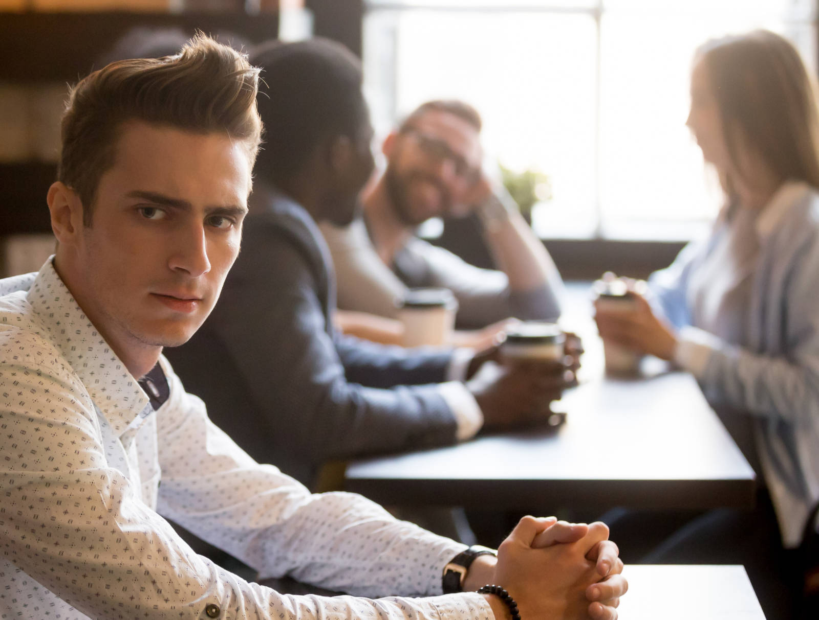 man sitting at a coffee shop