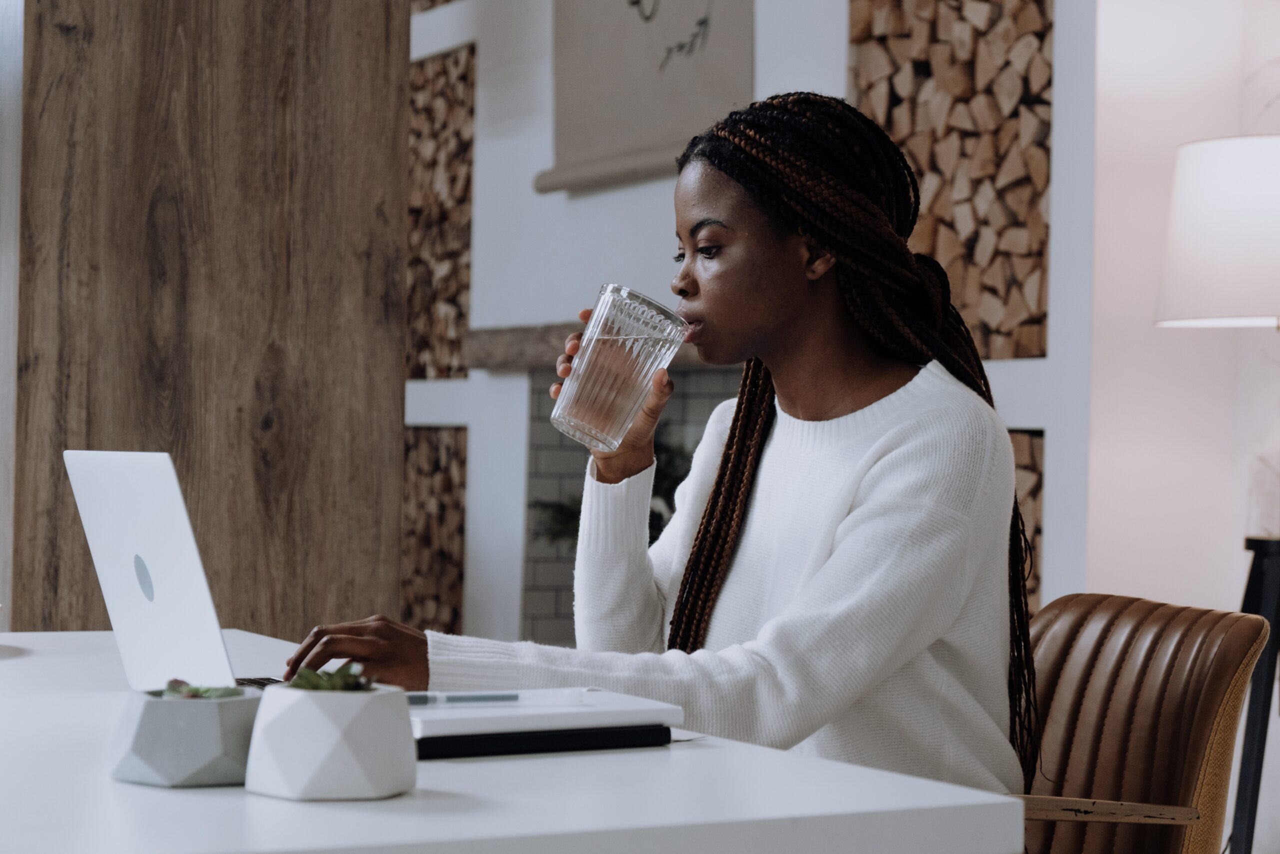 woman drinking a glass of water