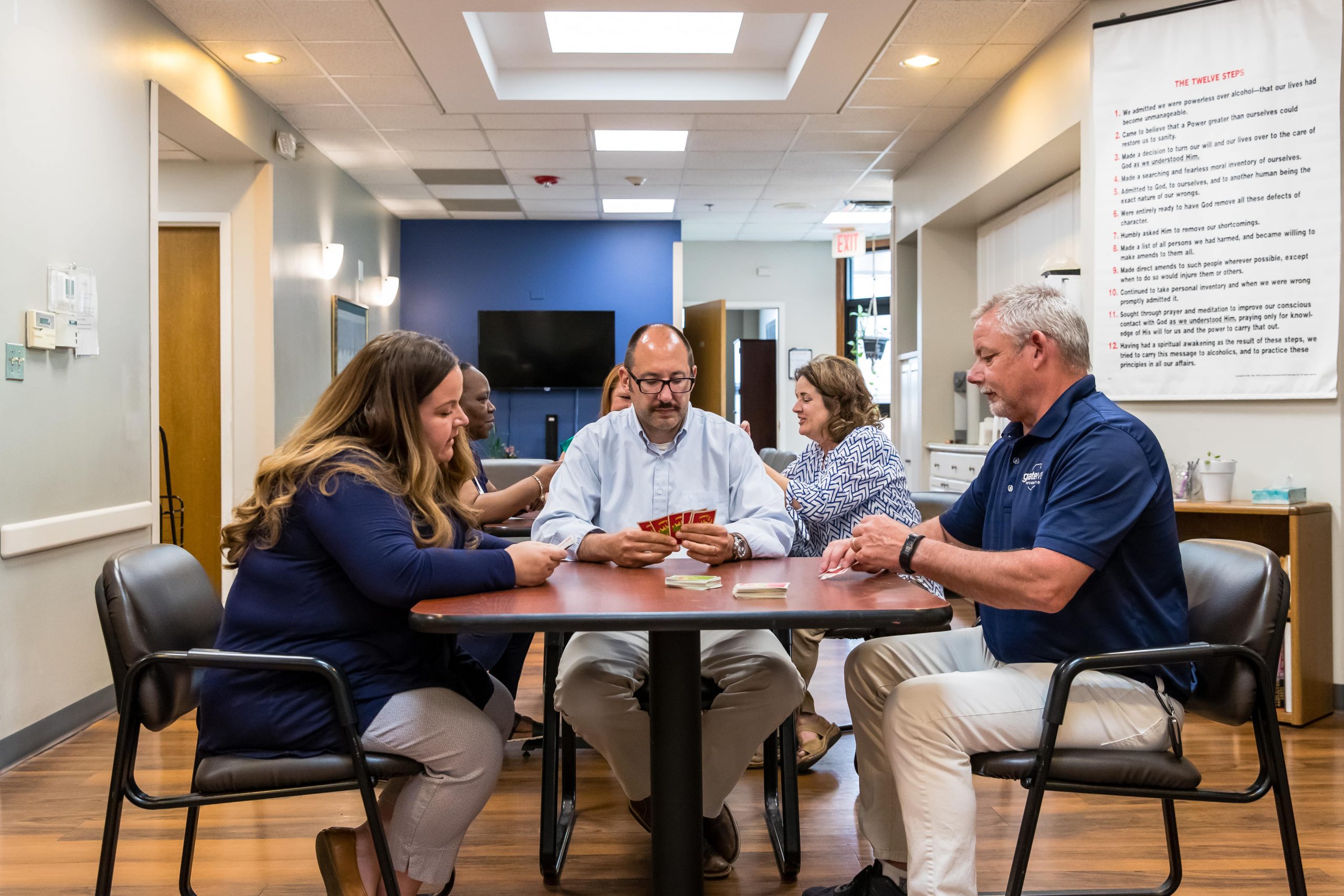 People Playing Card Game at Gateway Foundation Aurora