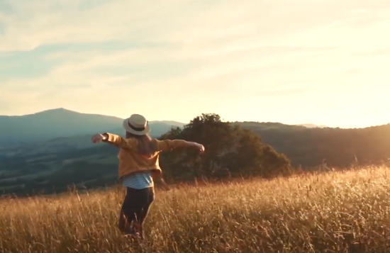 woman running through fields