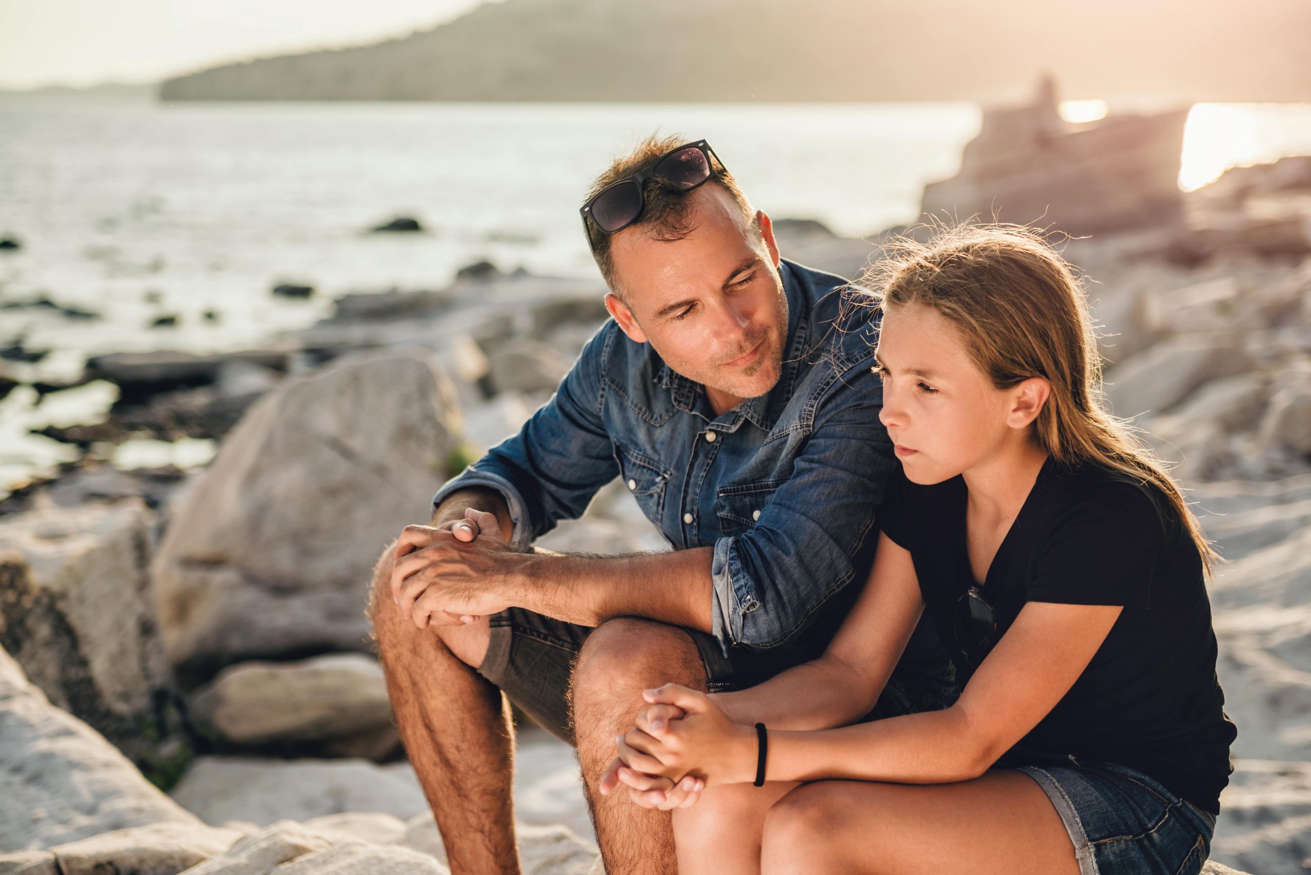 father talking to daughter