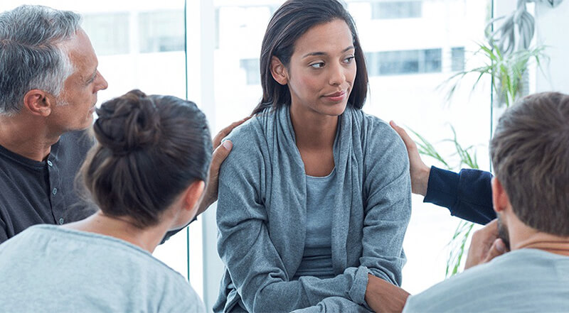 Woman in group therapy session