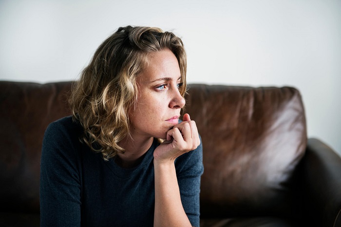 woman sitting on the couch