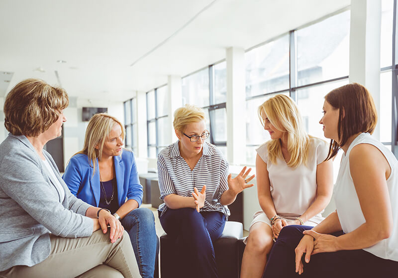 Therapist leading a women's therapy group