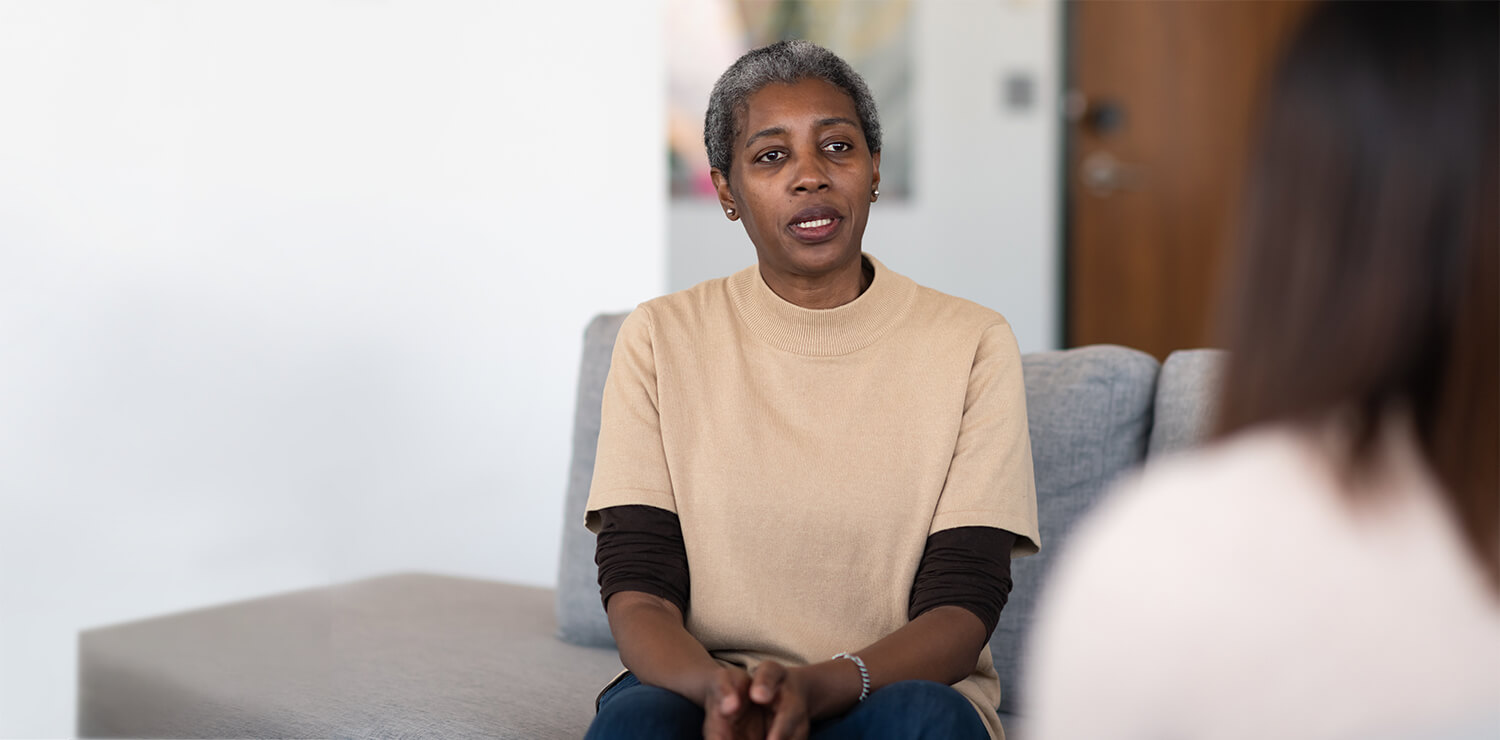 Woman speaking with her therapist