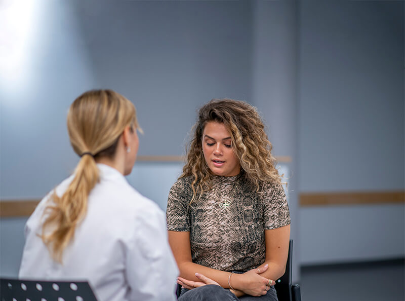 Woman meeting with her therapist