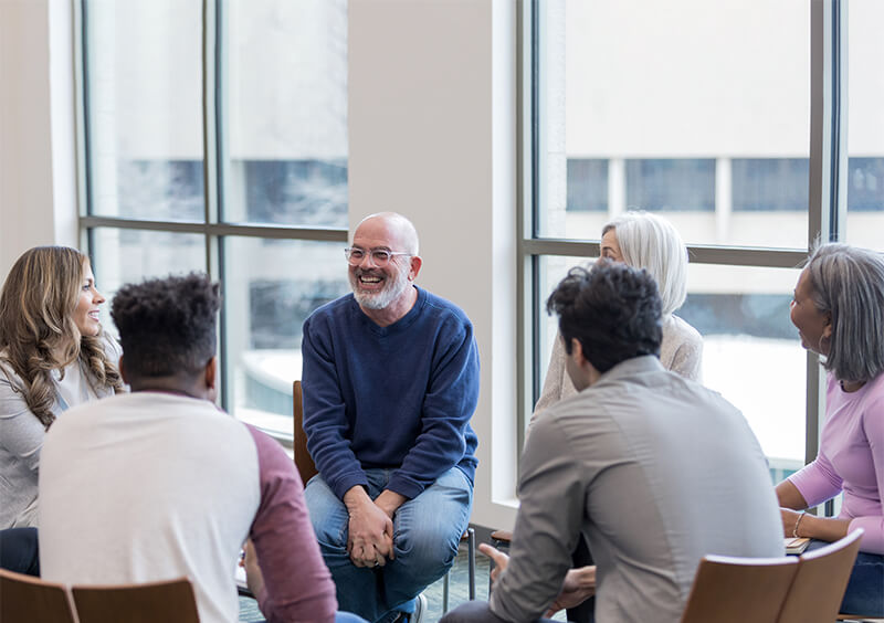 A man telling a story in a group therapy session