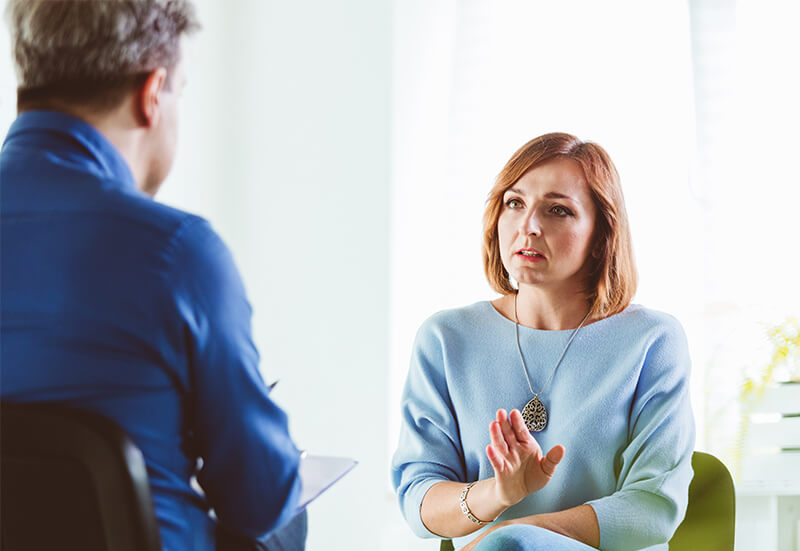 Woman talking to her therapist