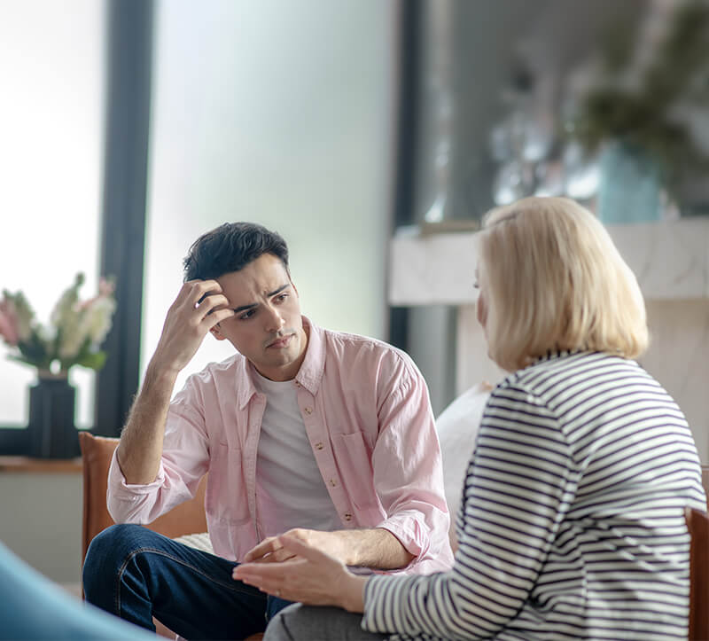 Man listening to his therapist