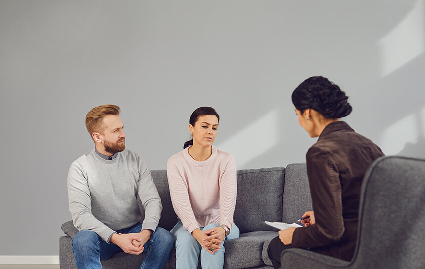 A couple meeting with a therapist