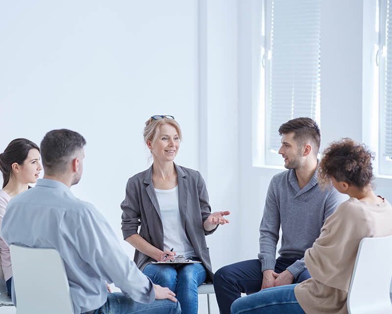 Therapist leading a group session