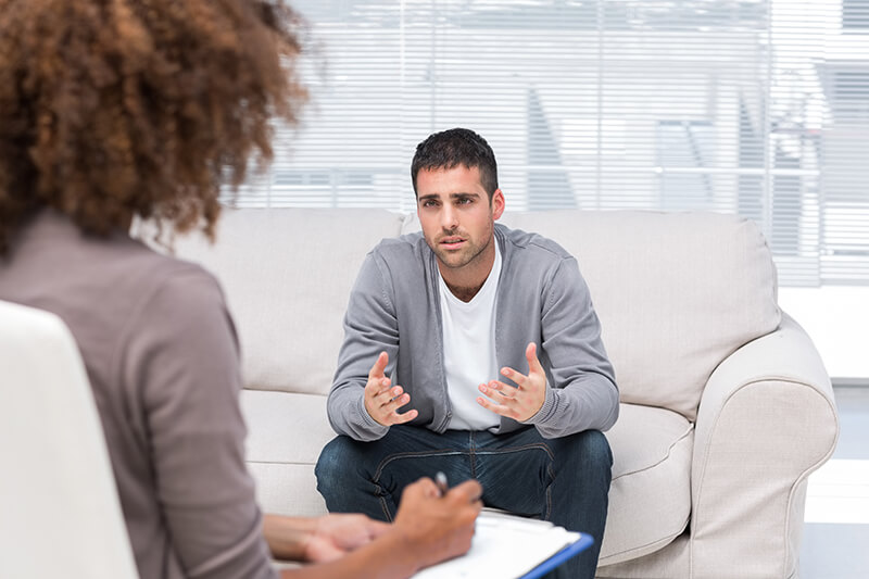 Man having a discussion with his therapist