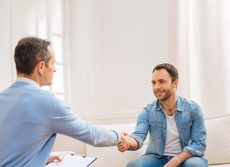 two men shaking hands