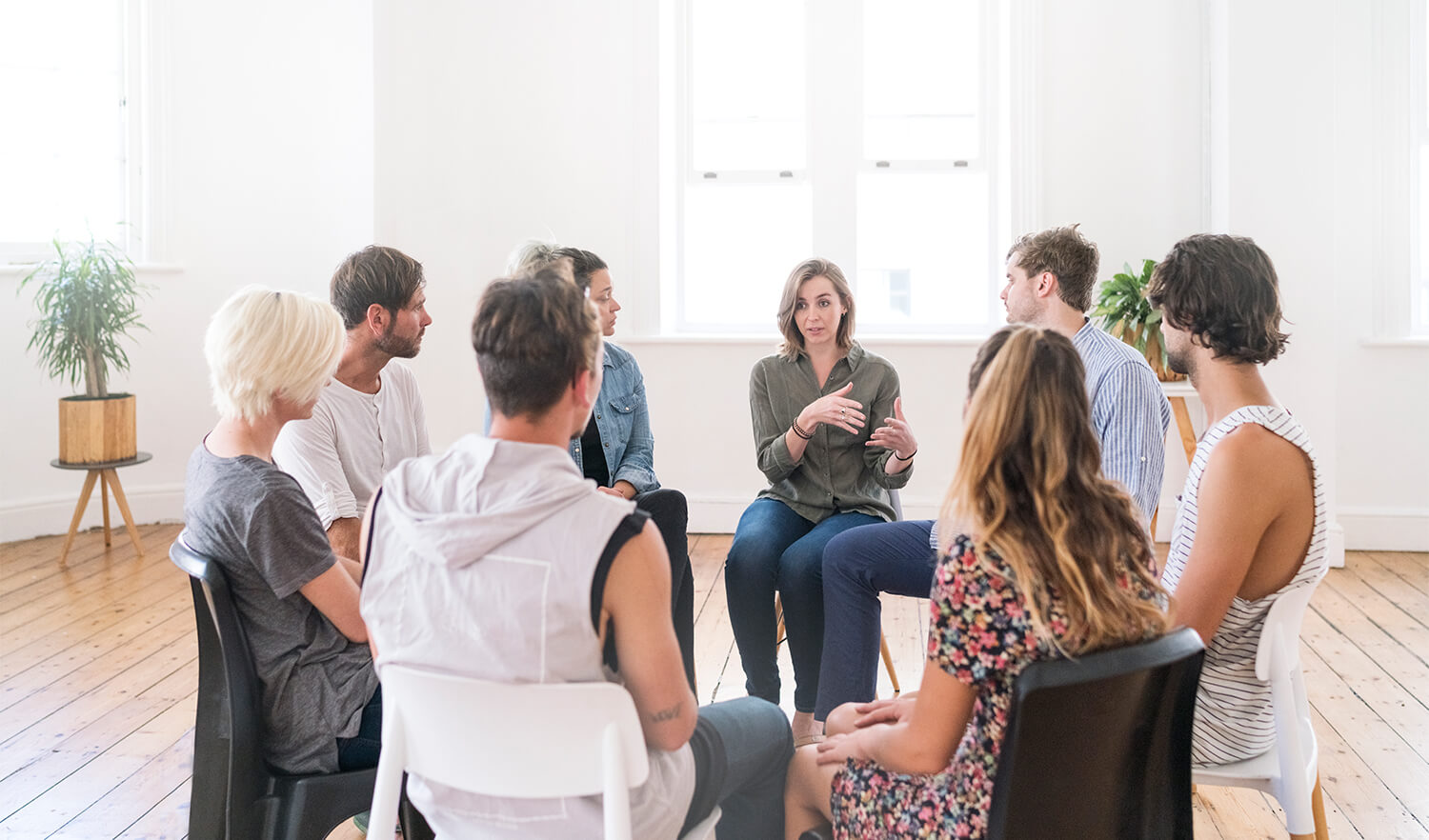 Woman talking in a group therapy session