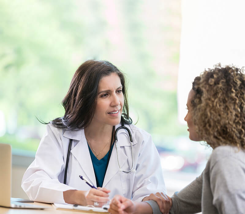 Doctor talking to her patient