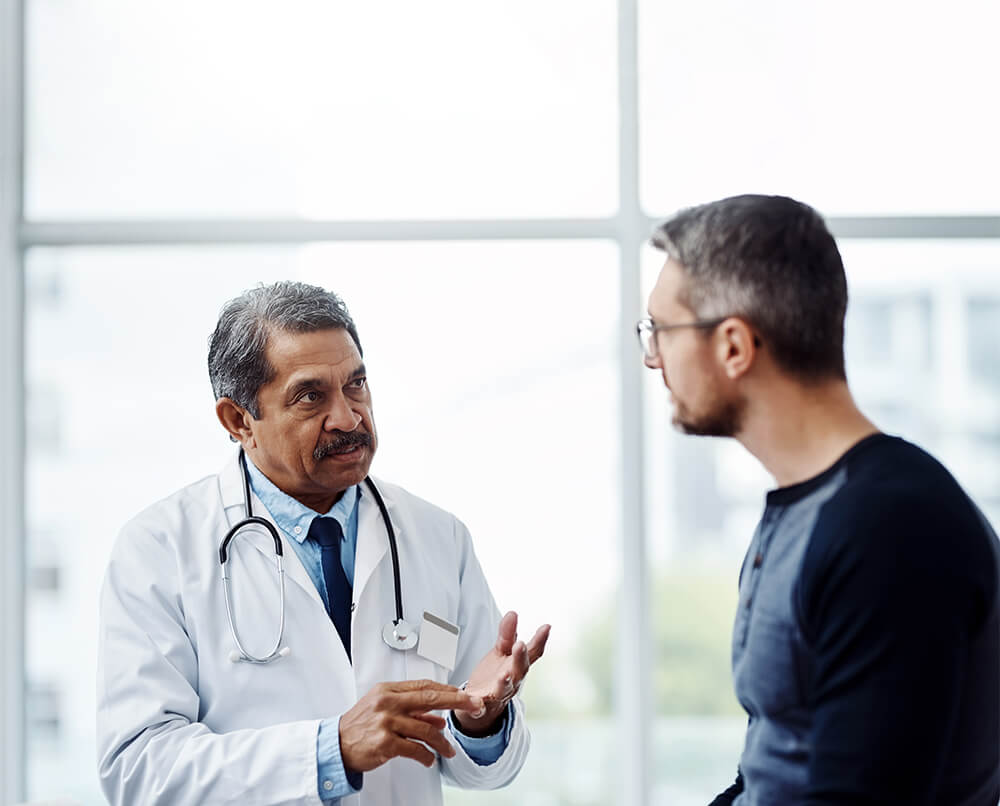 Man listening as his doctor talks to him