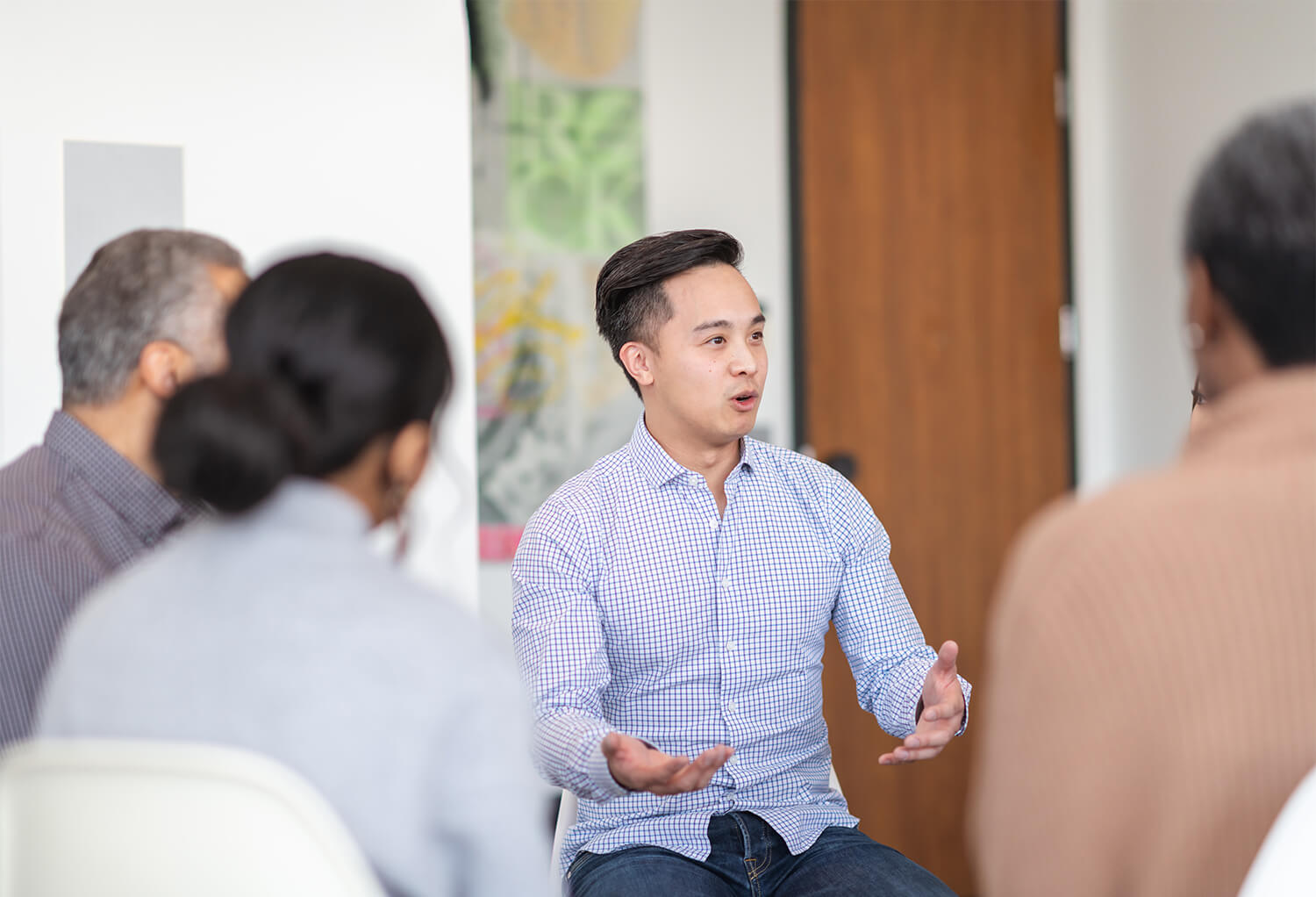 Man talking in a group therapy session