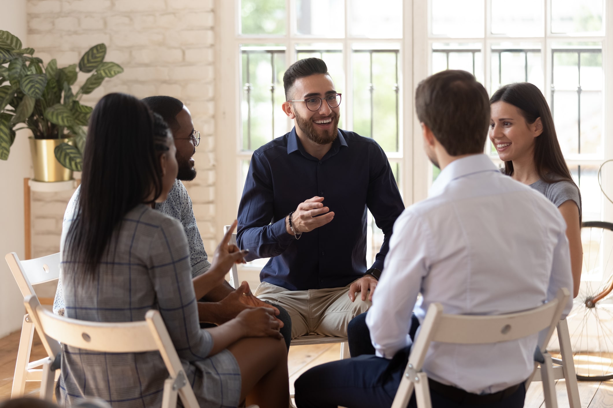 Man talking to a therapy group