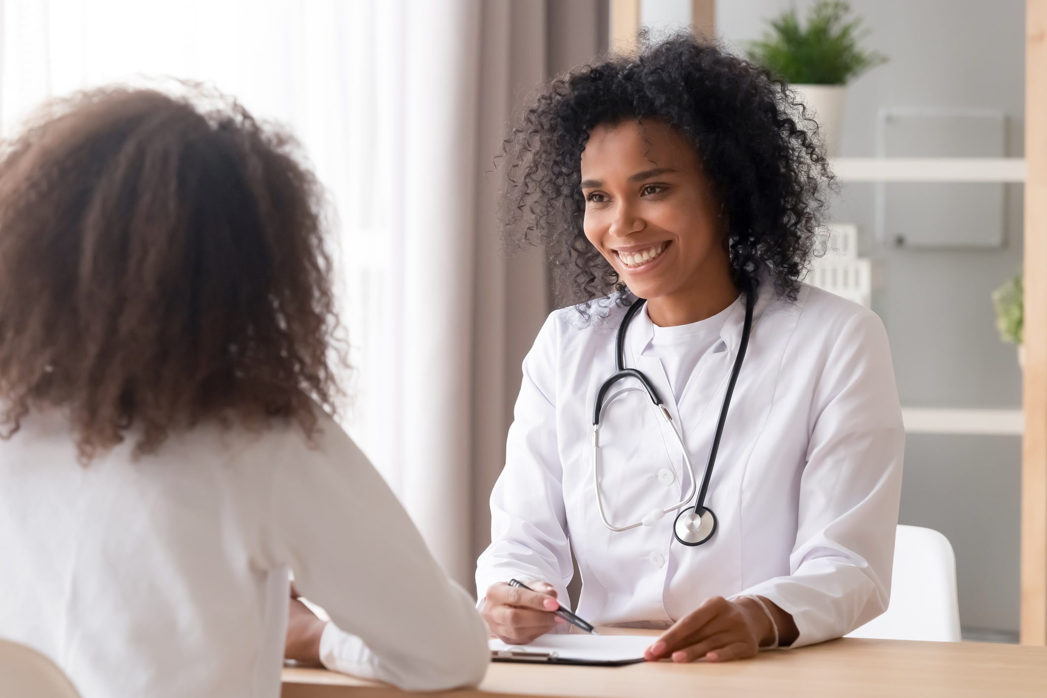 Doctor talking to her patient