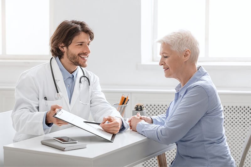 Doctor going over insurance information with his patient