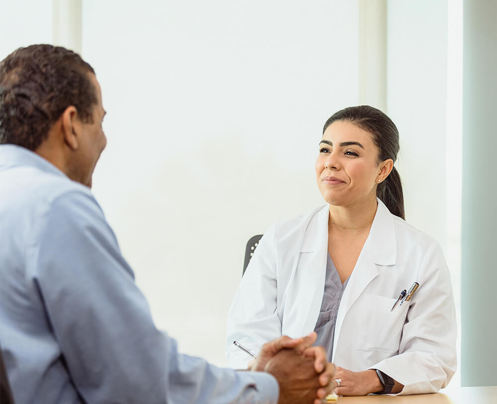 Doctor listening to her patient