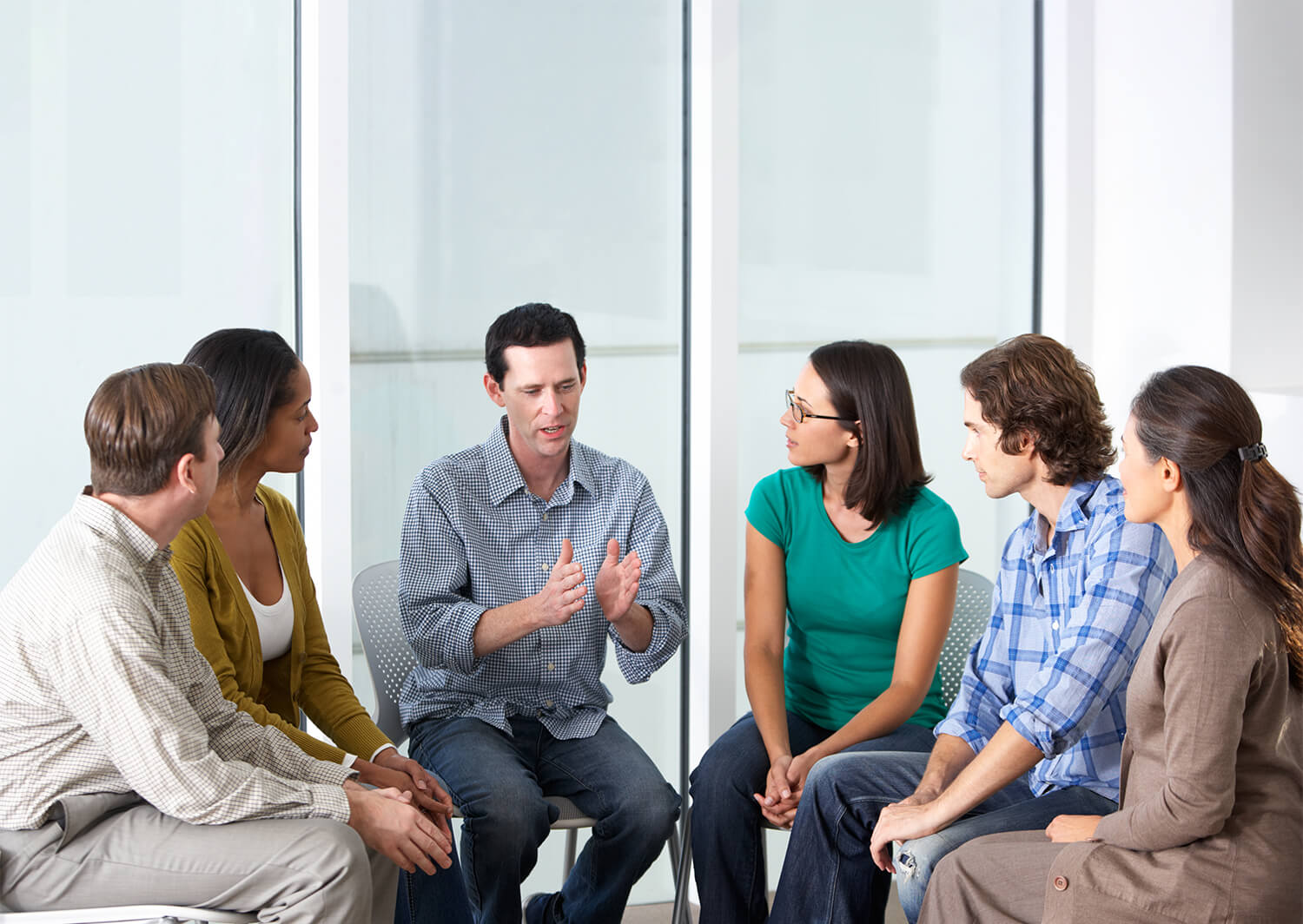 Man telling a story during a group therapy session