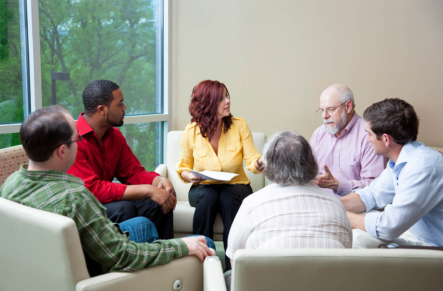 Therapist leading a group therapy session