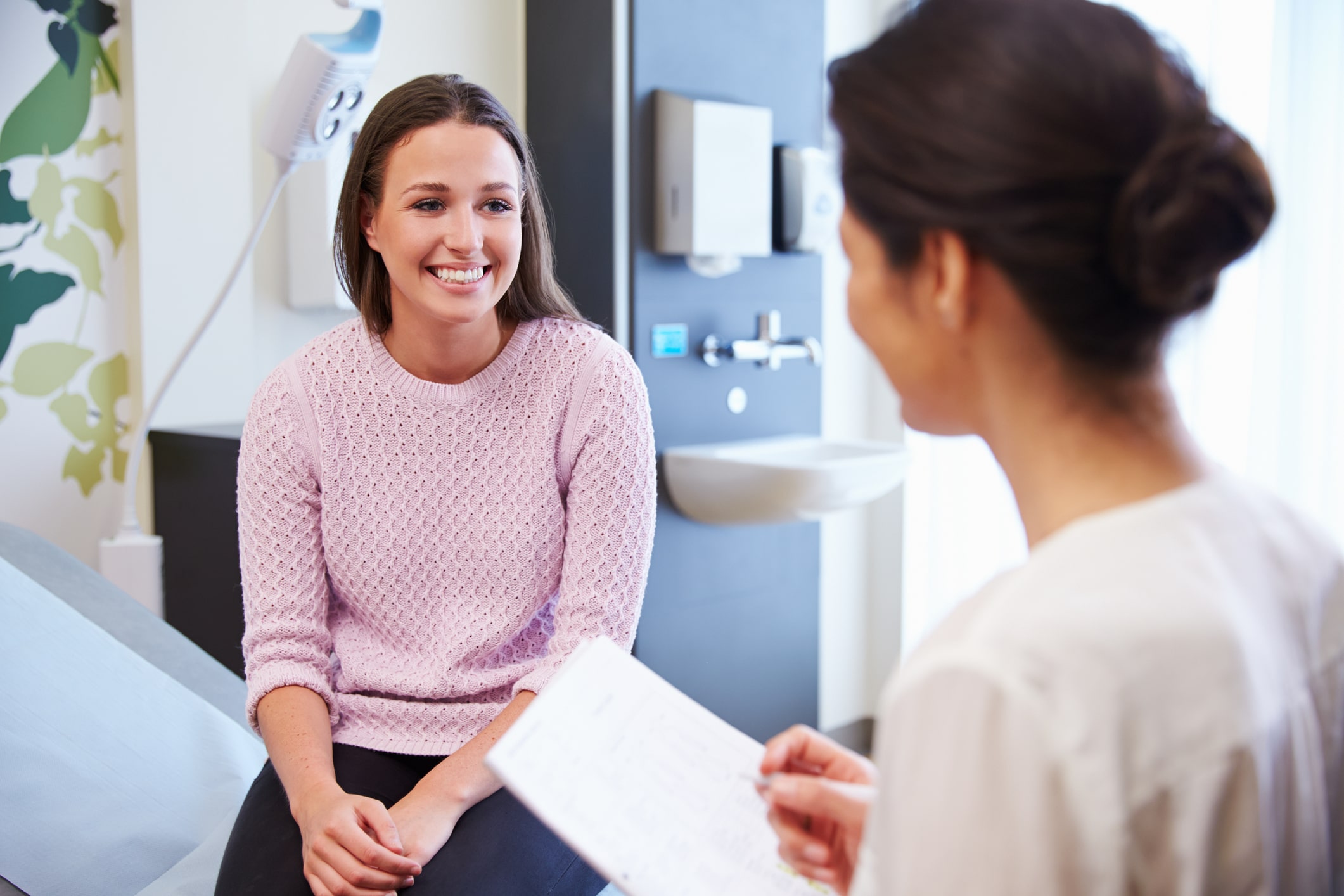 Doctor speaking to her client