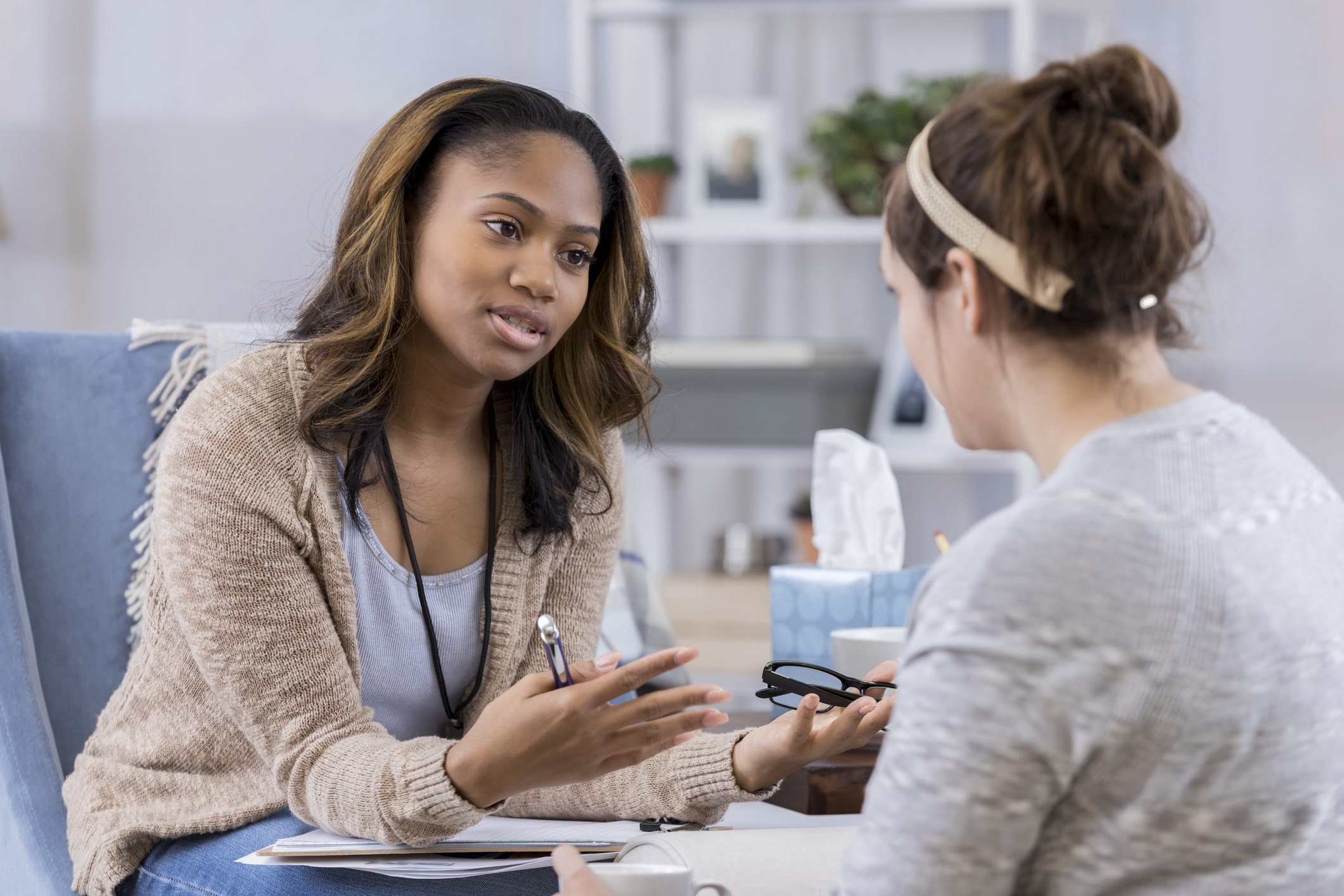 Doctor speaking to her client