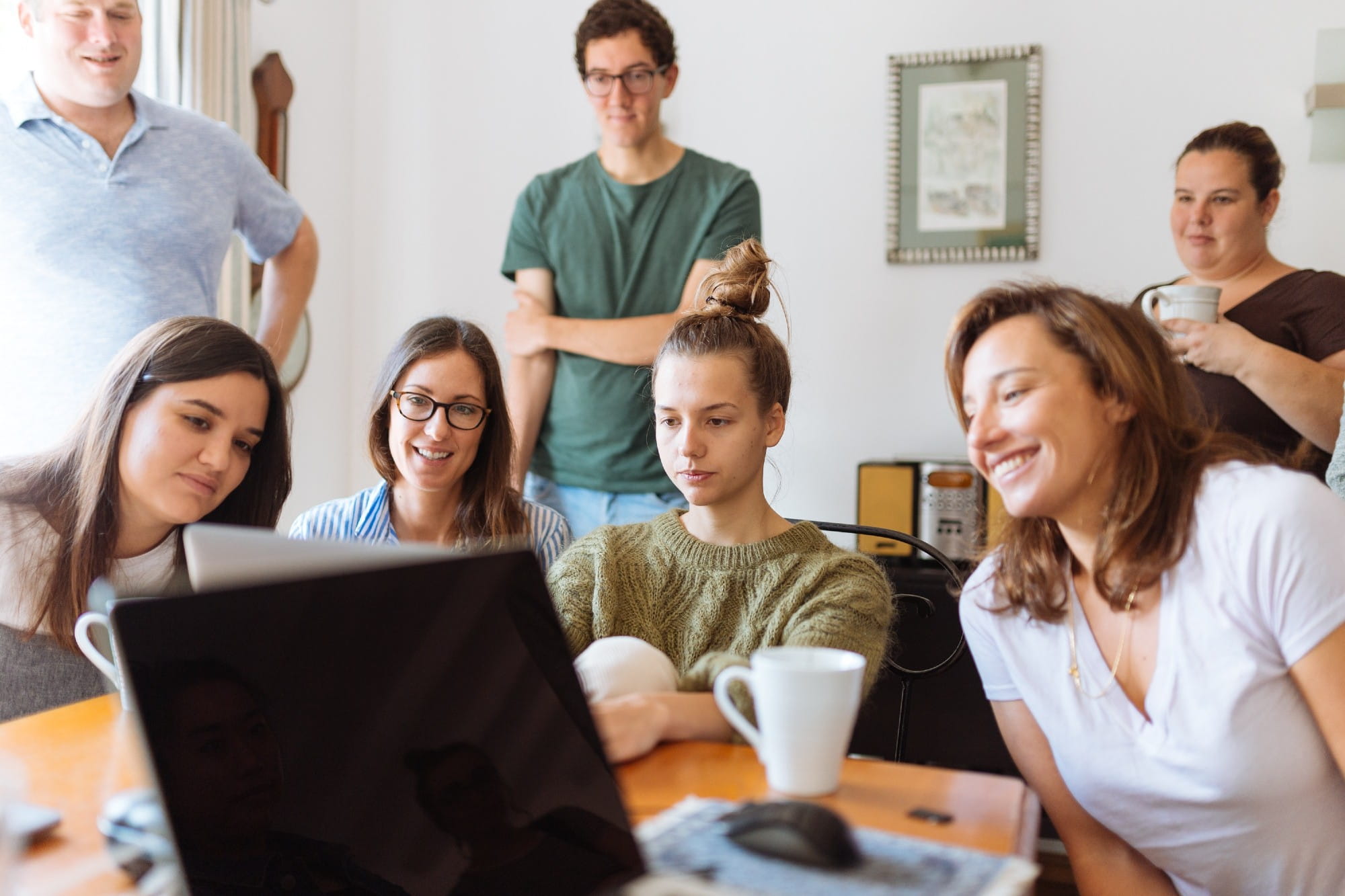 group of people looking at a monitor