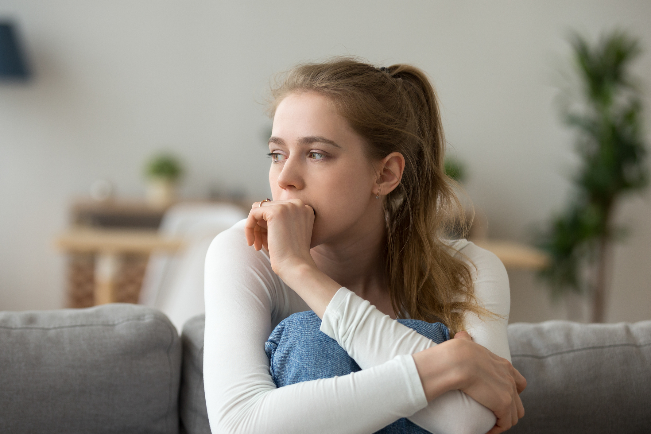 Woman who looks concerned. effects of alcohol addiction