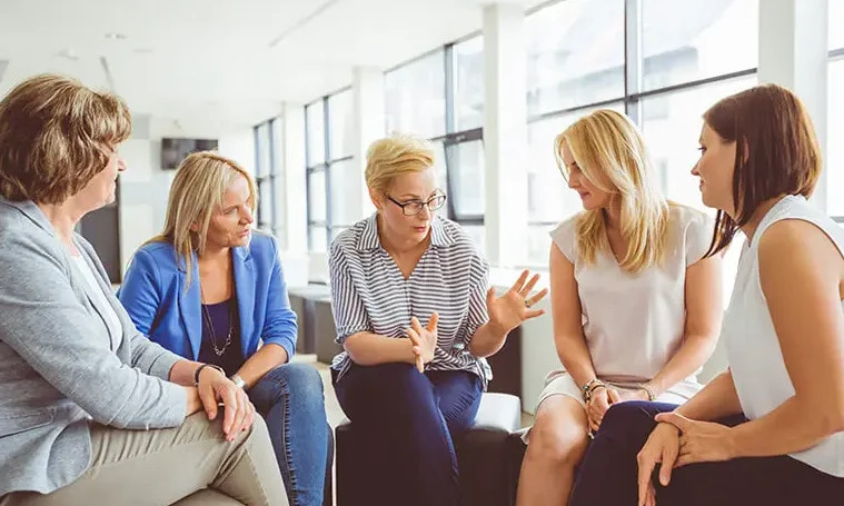 A group of women in a therapy session for SUD and trauma