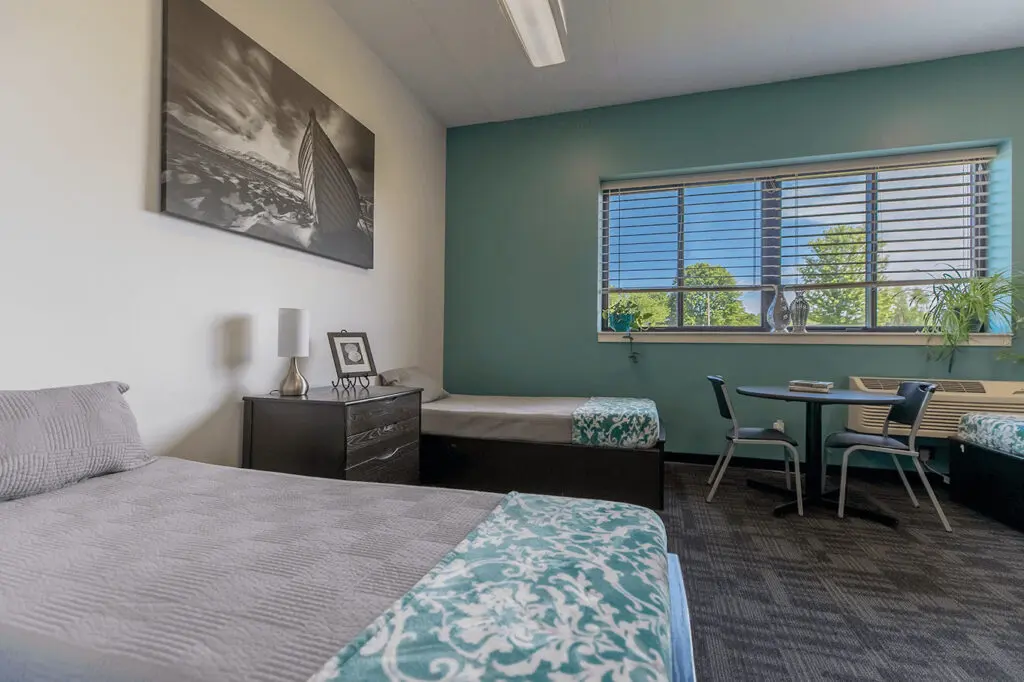 Two beds in a dorm room for residential addiction treatment